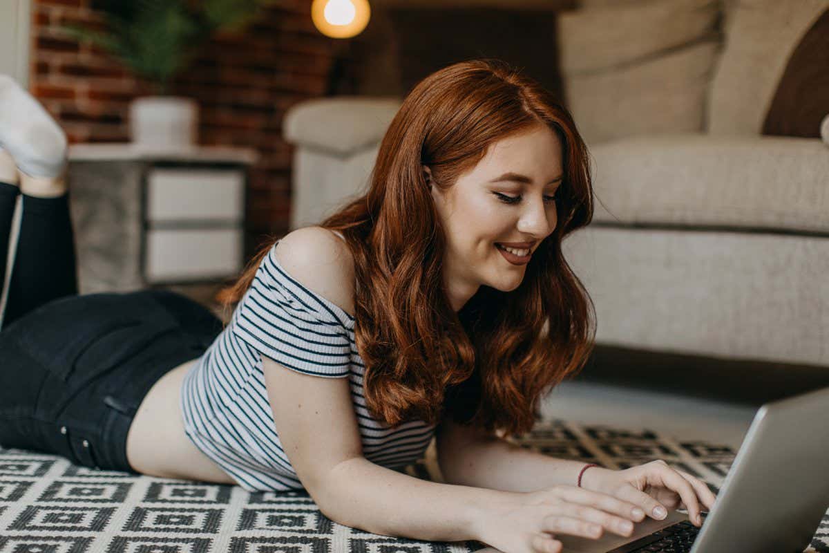 A girl using a keyboard to chat on the internet