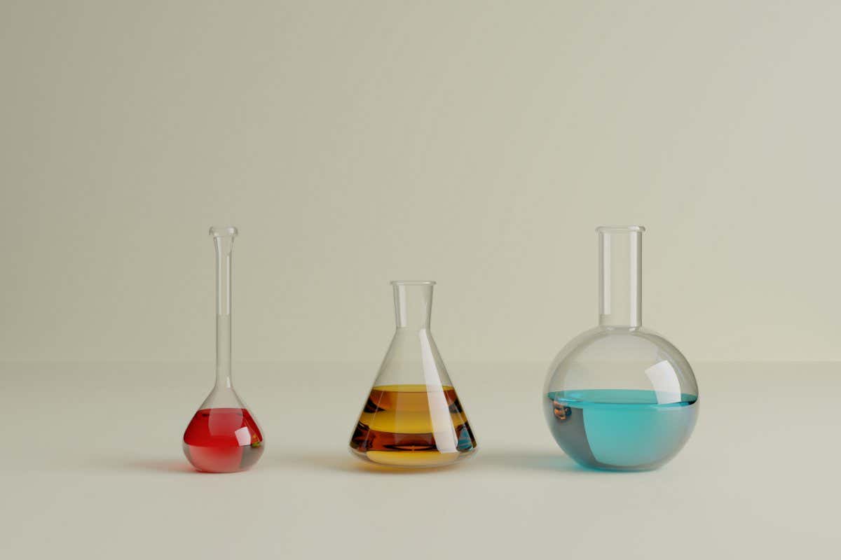 3d illustration. Set of a three small laboratory test tubes with different colored liquids on an isolated background. Science and laboratory equipment concept.
