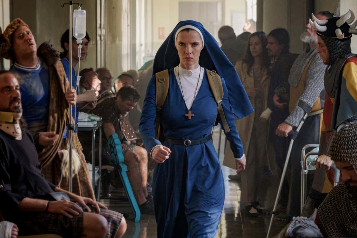 MRS. DAVIS -- "TBD" Episode 104 ??? Pictured: Betty Gilpin as Simone -- (Photo by: Sophie Kohler/PEACOCK)