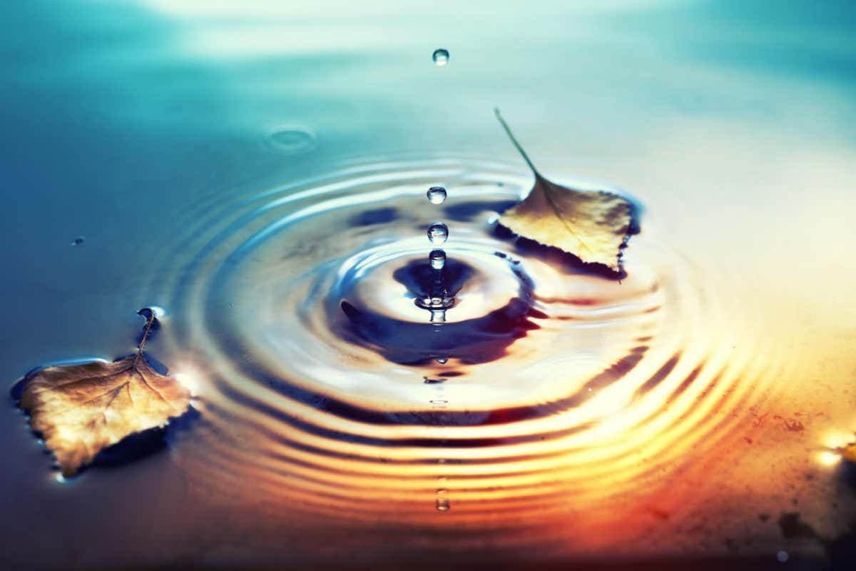 Droplet in water depicting emergence